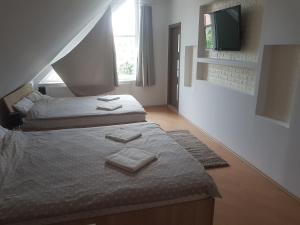 Postel nebo postele na pokoji v ubytování Lara Guest House