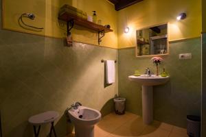 a bathroom with a sink and a toilet at Posada Camino del Norte in Güemes