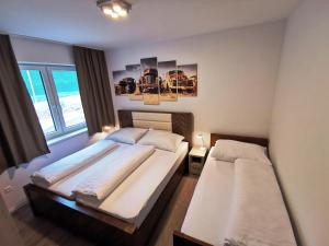 Un pat sau paturi într-o cameră la Bojnice Krásna Poruba