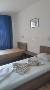 Postel nebo postele na pokoji v ubytování Complex Astra