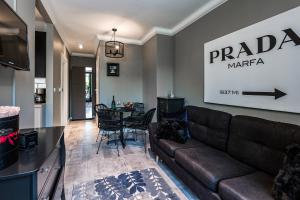 a living room with a couch and a table at ICON APARTMENTS in Gdańsk