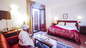 Voodi või voodid majutusasutuse Hotel Il Querceto toas