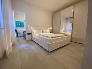 Appartamenti Mare Caorle客房内的一张或多张床位
