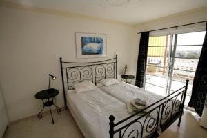 En eller flere senge i et værelse på Playa De Mogan Mirador 8 by El Sirocco