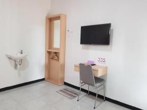TV a/nebo společenská místnost v ubytování Villetta House Syariah