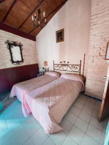 a bedroom with two beds and a mirror on the wall at PENSION VERGARA , Sevilla in Seville