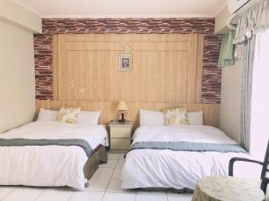 A bed or beds in a room at Chia Yun Homestay