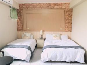 A bed or beds in a room at Chia Yun Homestay