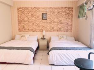 A bed or beds in a room at Chia Yun Homestay