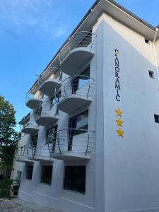 a white building with yellow stars on it at Panoramic in Eforie Sud
