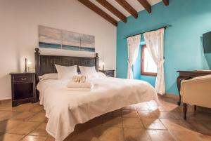 Postel nebo postele na pokoji v ubytování Petit Hotel Alaro