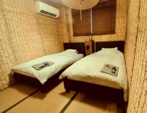 Posteľ alebo postele v izbe v ubytovaní Uno Port Inn