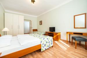 Postel nebo postele na pokoji v ubytování Hotel Orion