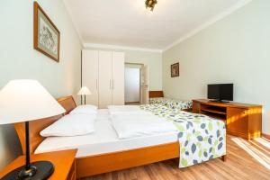 Postel nebo postele na pokoji v ubytování Hotel Orion