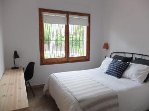Posteľ alebo postele v izbe v ubytovaní Entre Pinos P1 Beach Apartment