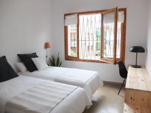 Voodi või voodid majutusasutuse Entre Pinos P1 Beach Apartment toas