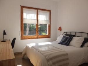 Posteľ alebo postele v izbe v ubytovaní Entre Pinos P1 Beach Apartment