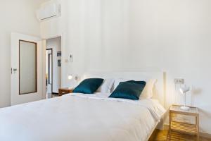 En eller flere senge i et værelse på San Donato Bologna Fiere Apartment