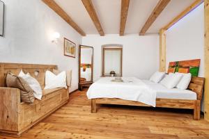 a bedroom with a bed and a large window at Haus Deutz in Oberaichwald