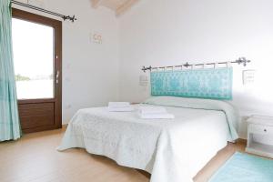 Postel nebo postele na pokoji v ubytování B&B Terra e Smeralda