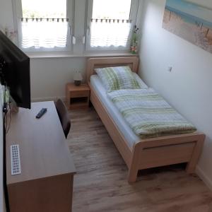 Postel nebo postele na pokoji v ubytování Gästehaus Strudthoff