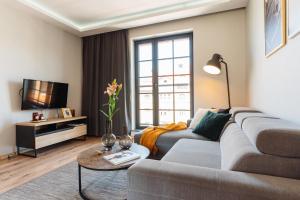 Televízia a/alebo spoločenská miestnosť v ubytovaní Brewery Apartment - LoftAffair
