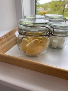 a tray with cookies in a glass jar on a counter at Millburn in Dunvegan