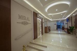 a hallway of a hospital with a sign on the wall at منزال الحزم للشقق المخدومة in Ar Rass