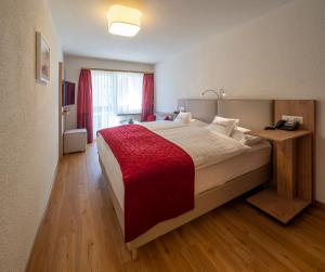 Postel nebo postele na pokoji v ubytování Hotel Sonne St. Moritz 3* Superior