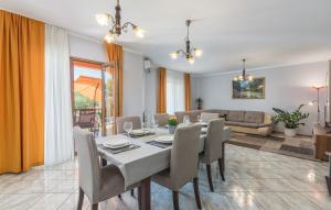 a dining room with a table and chairs at Villa Antonela in Radetići
