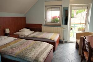 Кровать или кровати в номере Club Haus 502 Kalocsa