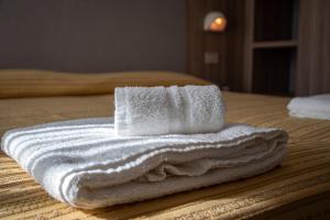 Postel nebo postele na pokoji v ubytování Hotel Astrid