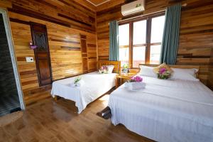Postel nebo postele na pokoji v ubytování Diep Le Homestay