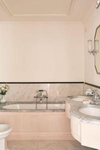 a bathroom with a tub and a sink at Splendido, A Belmond Hotel, Portofino in Portofino