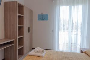 Postel nebo postele na pokoji v ubytování Hotel Astrid