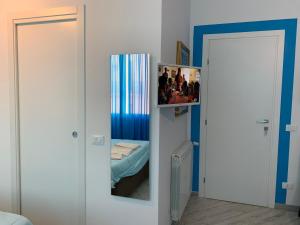 Łóżko lub łóżka w pokoju w obiekcie La Maison del Sole