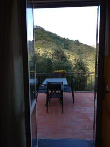 a view of a patio with a table and chairs at Appartamento il Giglio in Montale