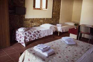 A bed or beds in a room at L'Antica Passolara