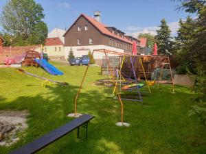 a yard with a bunch of playground equipment at Pension Medard in Boží Dar