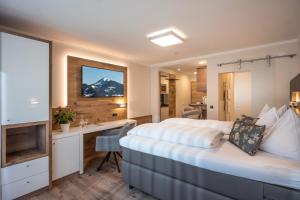 Letto o letti in una camera di Hotel Baumgarten & Chalet Baumgarten