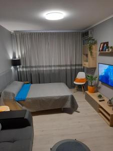 Posezení v ubytování НОВАЯ КРАСИВАЯ квартира.