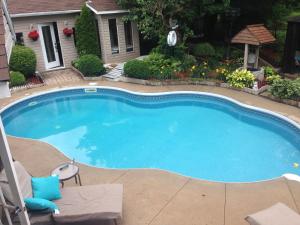 a large swimming pool in a yard at Chez Danny in Montreal