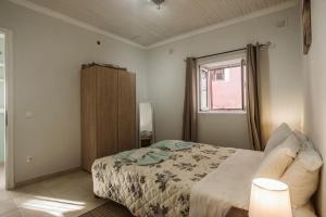 A bed or beds in a room at The Village Cottage - Benitses