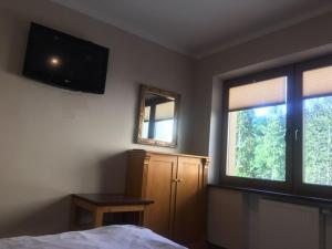 Telewizja i/lub zestaw kina domowego w obiekcie Willa Magnat
