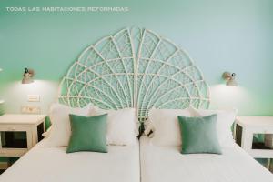 Posteľ alebo postele v izbe v ubytovaní Hotel Mar Azul & Surf