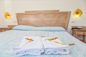 Postel nebo postele na pokoji v ubytování Hotel Bonsai