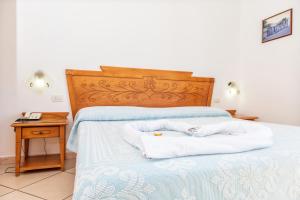 Postel nebo postele na pokoji v ubytování Hotel Bonsai