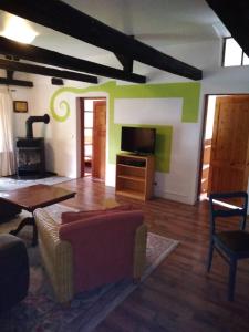 a living room with a couch and a stove at Ferienwohnung in Welzin in Damshagen