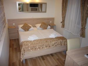 Postel nebo postele na pokoji v ubytování Old Town Suites