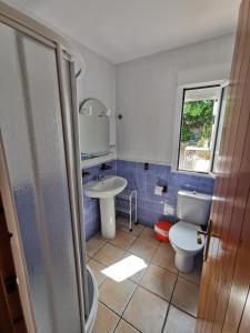 a bathroom with a toilet and a sink at Apartamento paula 2 in Níjar